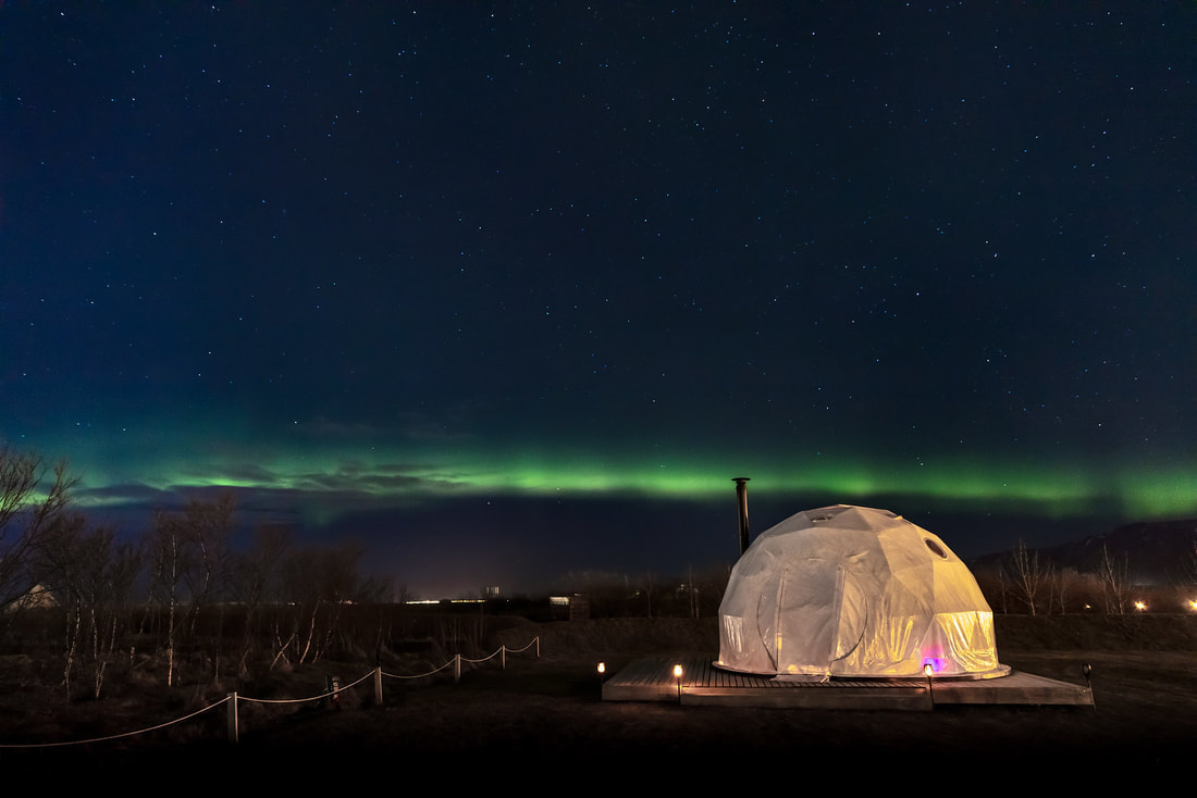 A Reykjavik dome under the northern lights